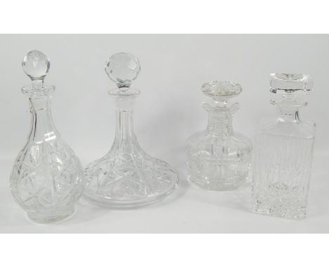 Four pressed glass decanters, including rectangular, bell shaped and ships decanters.