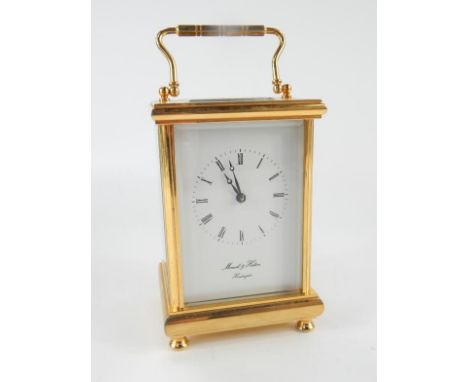 A brass and four glass carriage clock, by Morrell & Hilton of Huntingdon, having white face with Roman numerals and minute tr