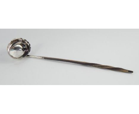 A Georgian silver toddy ladle, with twisted whalebone handle, London hallmarks worn, initialled 'GW'.