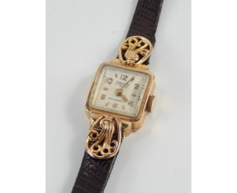 A 1930s Exactus ladies cocktail watch, having Arabic markers and minute track with gilt arrow hands, in yellow metal marked 1