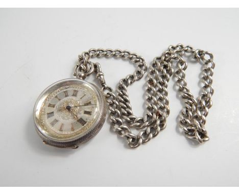 A late 19thC Continental fob watch, with engine turned dial, Roman numerals and minute track with gilt poire hands, with Cont