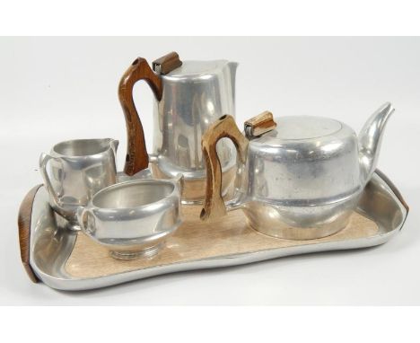 A Picquot ware tea service, comprising coffee pot, teapot, sugar bowl, milk jug and formica tray.