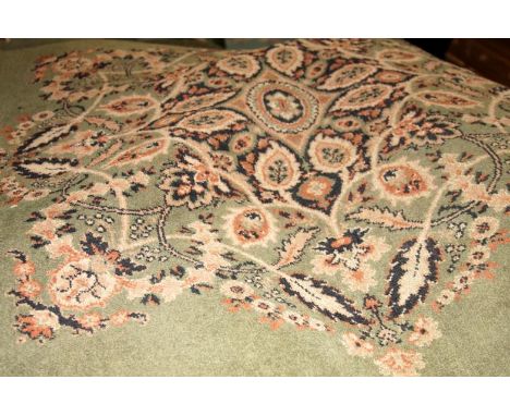 A Wilton bordered carpet, with floral scroll designs on green ground, 340cm x 270cm.