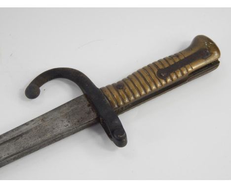 A French 19thC bayonet, with scabbard dated 1873, total length 71cm.