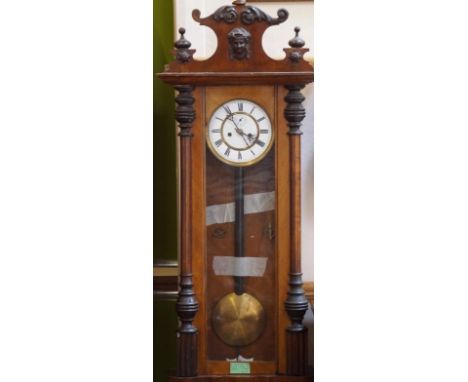 An early 20thC mahogany Vienna clock, having enamel dial with Roman numerals and having a separated chapter ring with Roman n