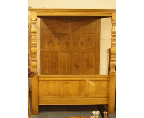 A light oak full tester bed, with Wainscot panelled back and top and turned front posts, 192cm wide.