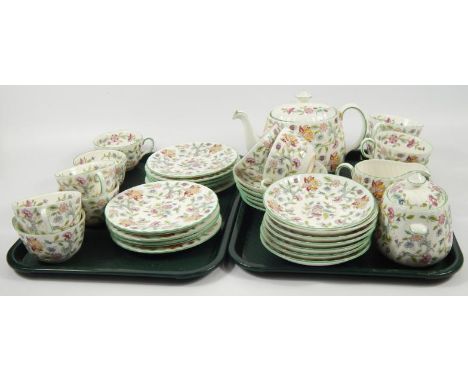 A Minton Haddon Hall pattern part tea service, comprising teapot, milk jug, sugar bowl, side plates, tea cups and saucers.