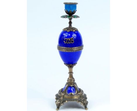 A Russian silver-gilt and guilloche enamel taper or candlestick, with petal sconce, egg shaped stem which detaches revealing 