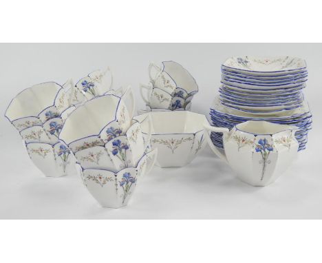 A 1930's Shelley porcelain part tea service, comprising octagonal teacups, sugar bowl, milk jug, saucers and cake plates.