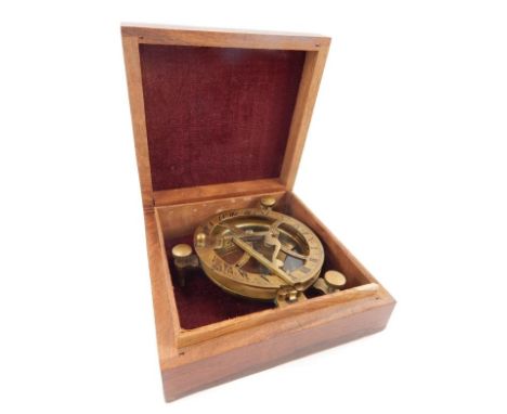 A brass compass, with integral spirit levels, marked Ramsden London in fitted mahogany case with brass corners also marked Ra