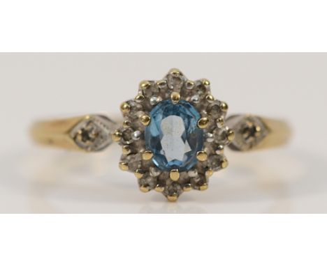 A 9ct gold blue gemstone and diamond cluster ring, London 1989, K 1/2, 1.8g