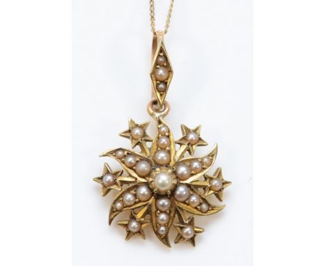 A 15ct gold seed pearl star shaped pendant on a chain, 15mm, 2.3g