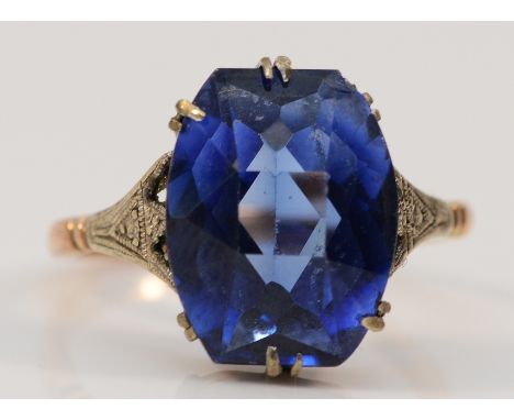 A 9ct rose gold synthetic sapphire cocktail ring, 13mm x 10mm sapphire, K, 3.6g
