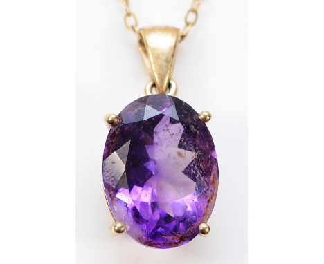 A 9ct gold amethyst pendant on a chain, 15mm x 12mm amethyst, 4g