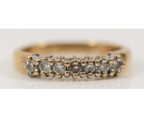 A 9ct gold brilliant cut diamond half eternity ring, stated 0.25ct, H, 1.5g