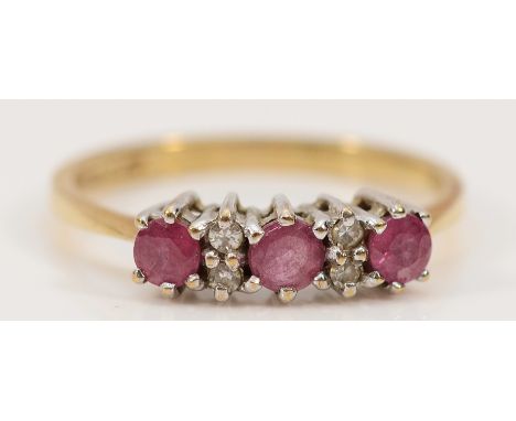A 9ct gold ruby and diamond dress ring, London 1989, N, 2g