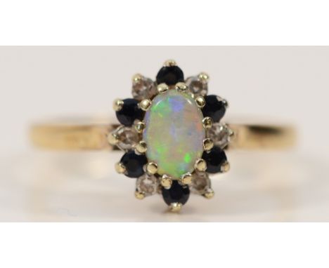 A 9ct gold opal, diamond and sapphire cluster ring, London 1985, M, 2.5g