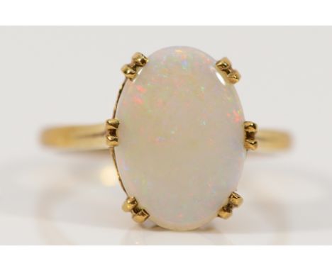 A 9ct gold opal solitaire ring, 14mm x 9mm opal, P, 3.2g