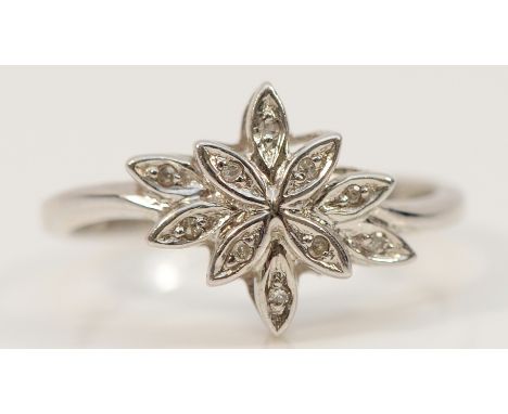 A 9ct white gold diamond floral dress ring, K 1/2, 1.9g