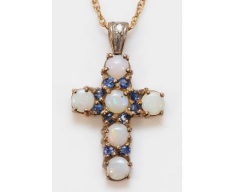 A 9ct gold opal and sapphire cross pendant on a chain, 20mm, 2.4g