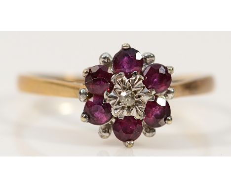 A 9ct gold ruby and diamond floral cluster ring, London 1980, O 1/2, 1.9g