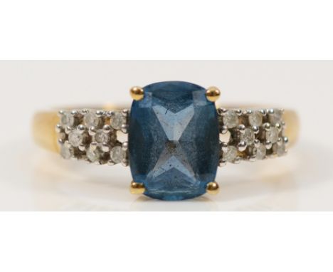 A 9ct gold blue topaz dress ring with diamond set shoulders, P, 2.6g