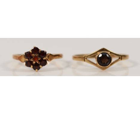A 9ct gold garnet solitaire ring, Birmingham 1983, O, with a 9ct gold garnet cluster ring, M, 2.8g