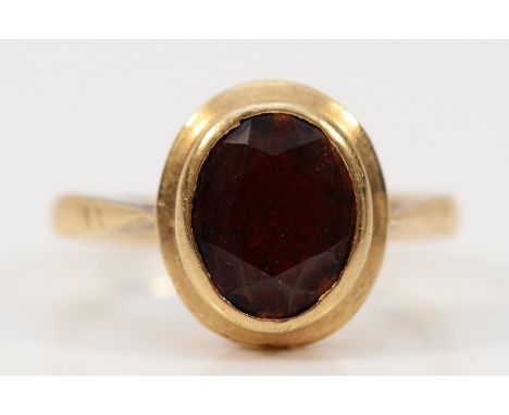 A 9ct gold garnet dress ring, 9mm x 8mm garnet, N, 2.8g