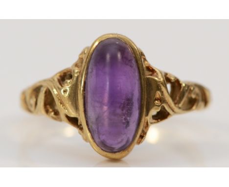 A 9ct gold cabochon cut amethyst dress ring, London 1978, 12mm x 5mm amethyst, O 1/2, 3.2g