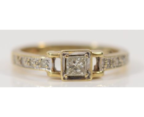 A 9ct gold Princess cut diamond solitaire ring with diamond set shoulders, stated 0.25ct, L, 2.1g