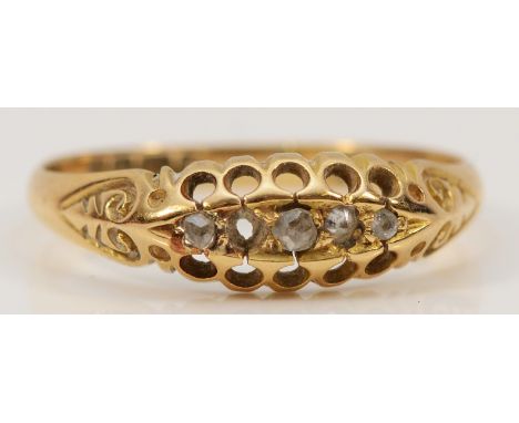 An 18ct gold old cut diamond five stone ring with carved claw details, one setting vacant, Birmingham 1900, O, 2g