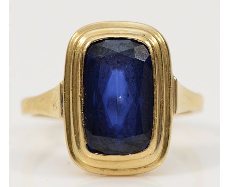 A 9ct gold synthetic sapphire dress ring, 12mm x 7mm sapphire, Birmingham import 1962, O, 3.6g