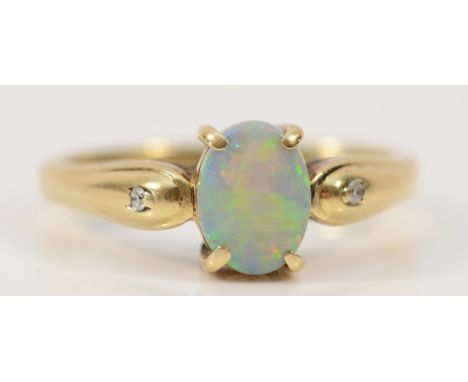 A 9ct gold opal solitaire ring with diamond set shoulders, 7mm x 5mm opal, M, 2.9g