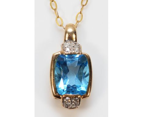 A 9ct gold blue topaz and diamond pendant on a chain, 9mm x 9mm topaz, 3.1g