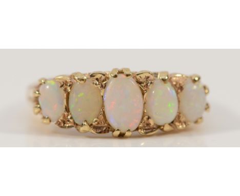 A 9ct gold opal five stone ring with carved claw detail, M 1/2, 4.4g