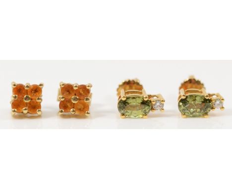 A pair of 9ct gold citrine earrings with scroll backs, together with a pair of 9ct gold diamond and peridot earrings with scr