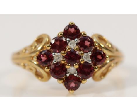 A 9ct gold garnet and diamond cluster ring, Q, 3.3g