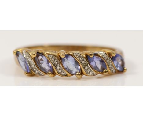 A 9ct gold tanzanite and diamond half eternity ring, hallmarks missing possibly due to resizing, P, 2.2g