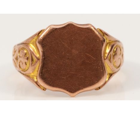 A 9ct rose gold shield shaped signet ring with patterned shoulders, Birmingham 1919, M, 6.3g Condition- Signs of resizing, ph