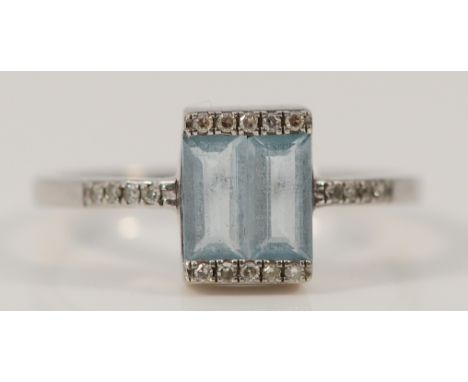 A 9ct white gold topaz dress ring with diamond set shoulders, K 1/2, 1.5g