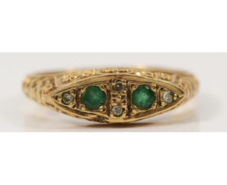 A 9ct gold emerald and diamond dress ring with carved claw detail, L 1/2, 2.8g