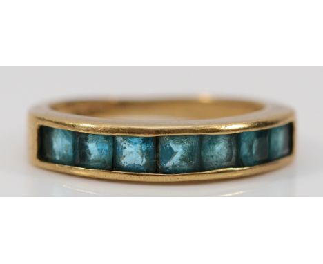 A 9ct gold blue gemstone channel set half eternity ring, J 1/2, 2.5g