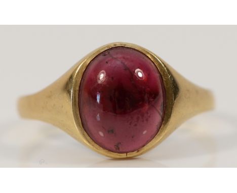 A 9ct gold garnet cabochon signet ring, 12mm x 10mm garnet, W, 3.3g