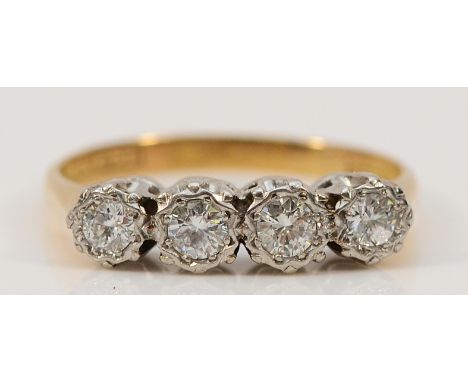 An 18ct gold and platinum four stone brilliant cut diamond ring, maker Bravingtons, M, 2.5g Condition-Very good condition, lo