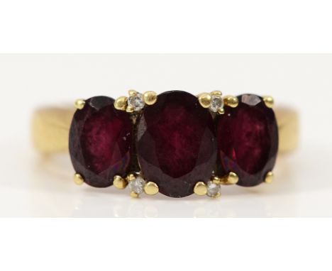 A 9ct gold garnet and diamond dress ring, L, 3g