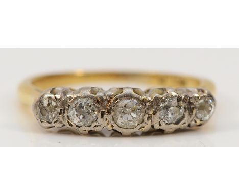 An 18ct gold and platinum five stone diamond ring, O, 4gThe central diamond is approx 0.15ct, the next are approx 0.10ct and 