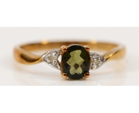 A 9ct gold garnet solitaire ring with diamond set shoulders, P, 1.9g