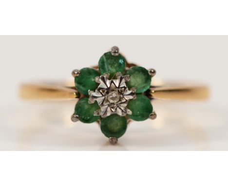 A 9ct gold emerald and diamond floral cluster ring, L, 2.1g