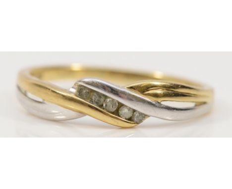 A 9ct yellow and white gold diamond cross over ring, P, 1.7g