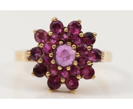 A 9ct gold ruby cluster ring, London 1979, O 1/2, 3.6g Condition-Full UK Hallmarks, all rubies are present with no chips or c
